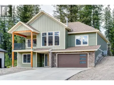Nestled in the desirable Whiskey Jack subdivision, this stunning home offers five bedrooms and three...