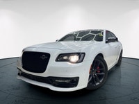 The 2023 Chrysler 300, particularly the 300C RWD in pristine white, is a powerful sedan that truly s... (image 2)
