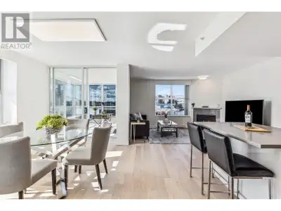 This stunning 1,211 sq. ft. SW-facing, corner unit offers breathtaking water views of False Creek, S...