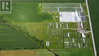 99.7 acre farm improved with several outbuildings and approximately 517,000 square feet of "interior...