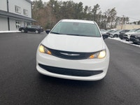 Experience the 2024 Chrysler Grand Caravan SXT in a pristine white finish, complete with efficient f... (image 2)