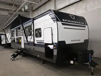 The 2026 Springdale 31SUNROOM is a travel trailer from Keystone RV with a single slide-out and a lay...