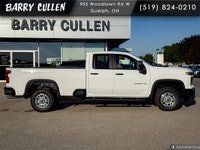 The 2026 Chevrolet Silverado 2500HD Work Truck in pristine white and equipped with a rugged 4x4 driv... (image 2)
