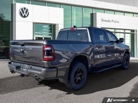 This 2021 Ram 1500 Sport Crew Cab, striking in Granite Crystal Metallic, stands ready for action, bo... (image 4)