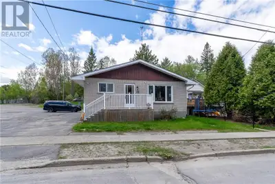 2 + 4 bedroom brick bungalow with a attached double car heated garage.Currently set up as two legal...