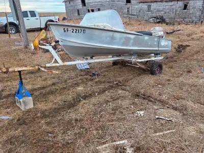 Boat motor and trailer as is. Been sitting in the yard for 20 years. Was take on trade for work by l...