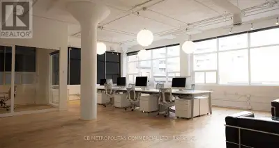 Bright 2nd floor studio loft office with wood floors, rounded mushroom columns, 2 private offices, m...