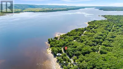 Embrace the ultimate waterfront lifestyle at 675 Bayview Drive, a rare building lot for sale in the...