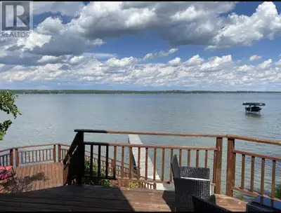 This beautifully updated "CABIN" is nestled in a cozy private setting on a large well treed lot in t...