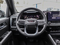 Meet the 2026 GMC Canyon Elevation Crew Cab Short Box 4-Wheel Drive Elevation, a black powerhouse re... (image 9)