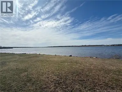 RARE OPPORTUNITY! 90 FEET OF FRONTAGE ON THE COCAGNE RIVER! 5 YEAR OLD WELL AND SEPTIC/ ELECTRICAL E...