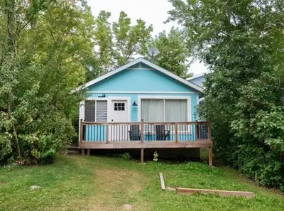 18 3RD Ave , Grand Beach ✨ Beachside Bliss at Grand Beach! Discover the perfect retreat with this we...