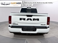 Introducing the 2026 Ram 2500 Big Horn 4x4 Crew Cab with a 64 Box in a vibrant white exterior paired... (image 3)