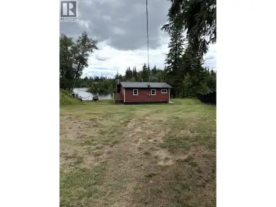 Rare Opportunity – Lakefront Cabin on Sought-After Ness Lake. Step into summer serenity with this be...
