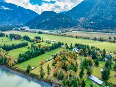 Sprawling 5.47-Acre Riverfront Home - Zoned AG-1 ! This award-winning hobby farm features 216 feet o...