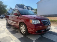A spacious family minivan with comfortable seating, convenient features, and versatile cargo space,... (image 2)