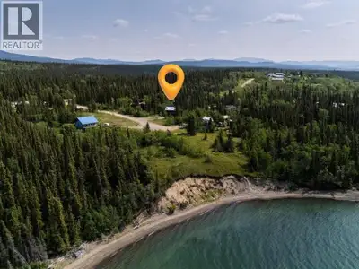 Enjoy stunning sunsets and unobstructed views of Marsh Lake from this beautifully built 3-bedroom, 1...