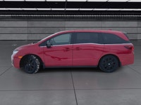 The 2025 Honda Odyssey Black Edition in a striking Red finish, equipped with a Front-Wheel Drive, of... (image 4)