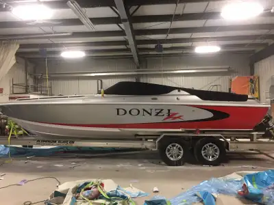 2006 DONZI 28 ZXO. Boathouse kept. Fresh water only. Second owner. Open bow with mid cabin. Tonneau...