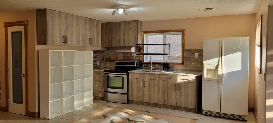 Bright & Spacious 3-Bedroom Legal Walkout Suite in Arbour Lake 5
