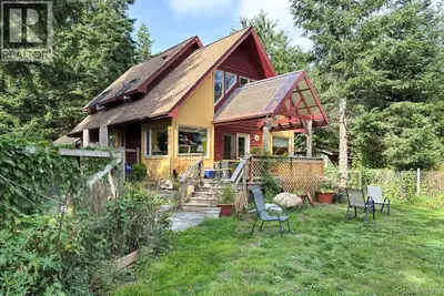 Welcome to this inviting two-level home, built in 2001, perfectly situated on a peaceful half-acre i...