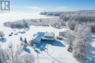 Welcome to your dream home on the shores of Hay Bay! This custom-built two-story masterpiece, constr...