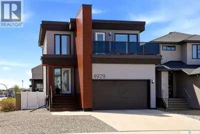 Step into refined contemporary living at 4929 E Green Brooks Way in one of Regina’s most desirable e...