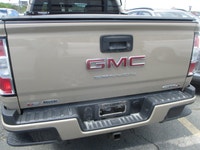 Finished in Desert Sand Metallic with a Black interior, this 2022 GMC Canyon 4wd At4 Cloth brings mi... (image 3)