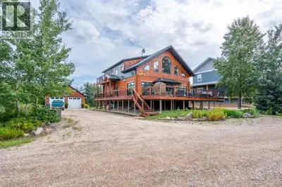 Stunning custom log home at Lac Des Ilse is just steps from the lake. With over 3000 square feet of...