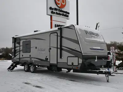 The 2019 Forest River Wildcat 245RGX is a mid-size travel trailer known for its rear-kitchen layout...