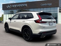 The 2026 Honda CR-V Hybrid Touring isn't just an SUV; it's your efficient and sophisticated partner... (image 2)