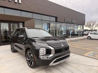 The 2023 Mitsubishi Outlander PHEV LE is a plug-in hybrid SUV that combines fuel efficiency, electri... (image 1)