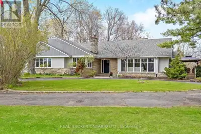 This gorgeous 4+1 bedroom, 3.5 bath bungalow has an in-law suite and sits on a private 1.43 acre lot...