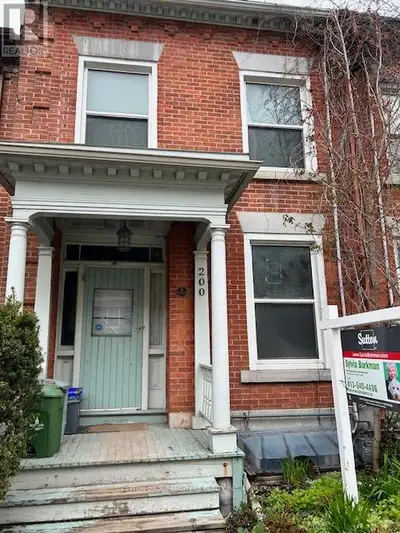 200 Bagot Street is designated as a Historical Building, note the plaque on the front and the inform...