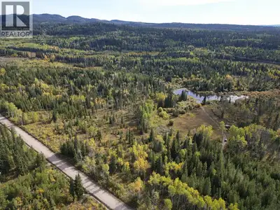 Embrace the ultimate outdoor lifestyle with this expansive 147-acre property, offering 2,690 ft of h...