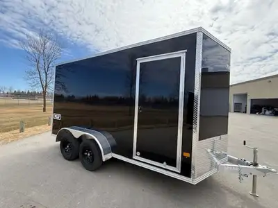 7x14 XLT, with rear ramp door, and side door. 2x3500lb axles. Black in colour. 2026 Triton Trailers...