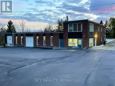 Unique 1 acre property featuring a freestanding 9000 sq ft Commercial/industrial Building with an up...