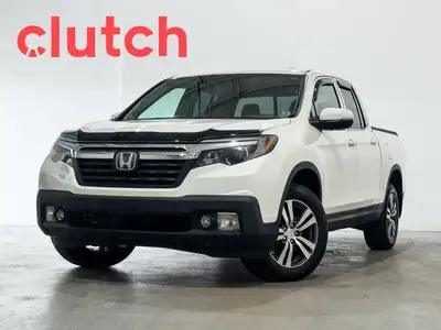 Auto Dimming Rearview Mirror, Front Heated Seats, Power Lumbar Support and more! Clutch is the large...