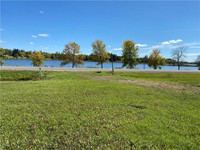 Stunning lakeview property on 1.35 ac within town limits!