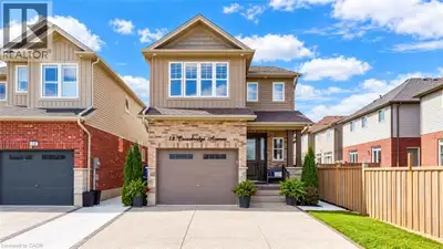 Welcome to 18 Crossbridge Ave, Kitchener: a beautifully maintained home nestled in the highly sought...