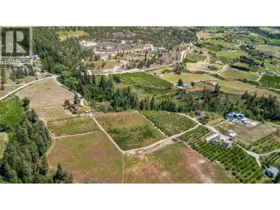 Presenting a truly lovely acreage with sweeping lake views, in a private setting yet easily accessib...