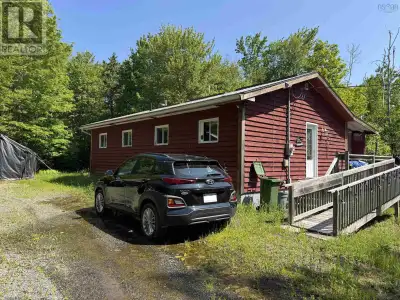 Welcome to this inviting four-season home or cottage nestled in a peaceful, private setting with dee...