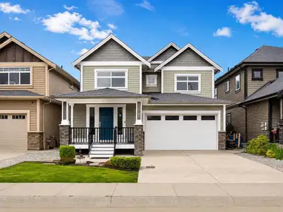 6 bedroom, 4 full bathroom basement entry home on a quiet family-oriented street surrounded by newer...