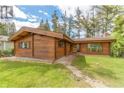 Embrace the warmth and character of this 5-bedroom custom-built Pan-Abode red cedar home, ideally si...