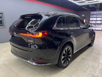 The 2024 Mazda CX-90 PHEV GT in a stunning black finish offers the perfect blend of luxurious style... (image 8)