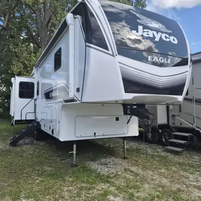 Jayco Eagle fifth wheel 321RSTS highlights: King Bed Slide Out Triple Slides Two Power Awnings Ceili...