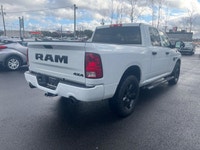 The 2022 Ram 1500 Classic Express, presented in a pristine white finish, is equipped with a robust 4... (image 5)