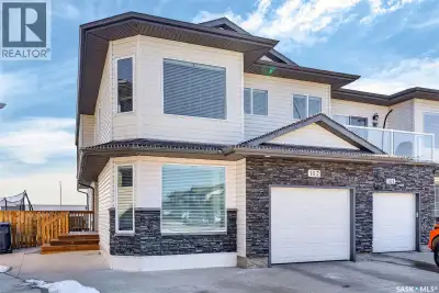 Welcome to 102 Meadowlark Park—an exceptional and uniquely designed half duplex situated on a large...
