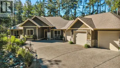 Luxury living awaits in this beautifully appointed 2,700+ sq ft rancher, privately set on 1.5 acres...