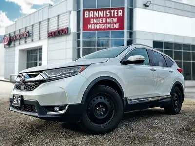 Experience an exceptional driving journey in the 2017 Honda CR-V Touring, featuring an immaculate wh...